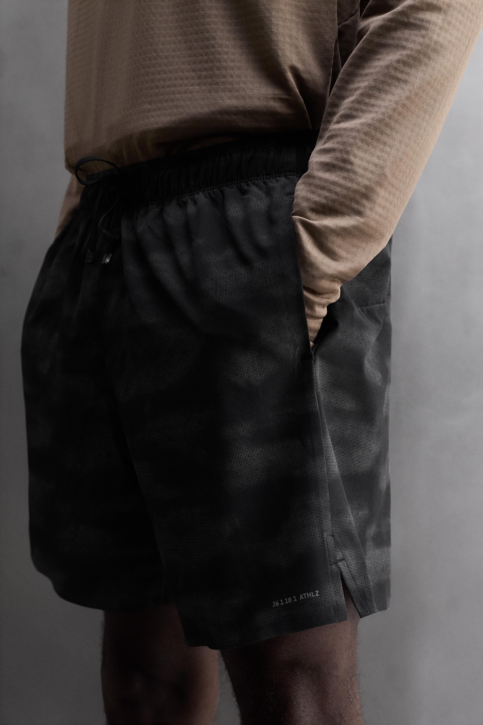 PERFORATED RUNNING SHORTS